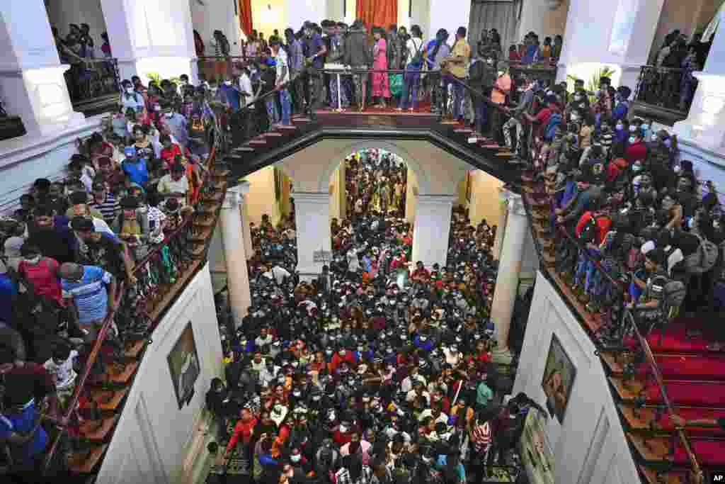 People crowd President Gotabaya Rajapaksa&rsquo;s official home for the second day after it was stormed in Colombo.&nbsp;Sri Lanka&#39;s government has collapsed as people are calling for the president and prime minister to resign over the country&#39;s economic problems.&nbsp;(AP Photo/Eranga Jayawardena)