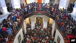 People throng President Gotabaya Rajapaksa’s official residence for the second day after it was stormed in Colombo, Sri Lanka, July 11, 2022.
