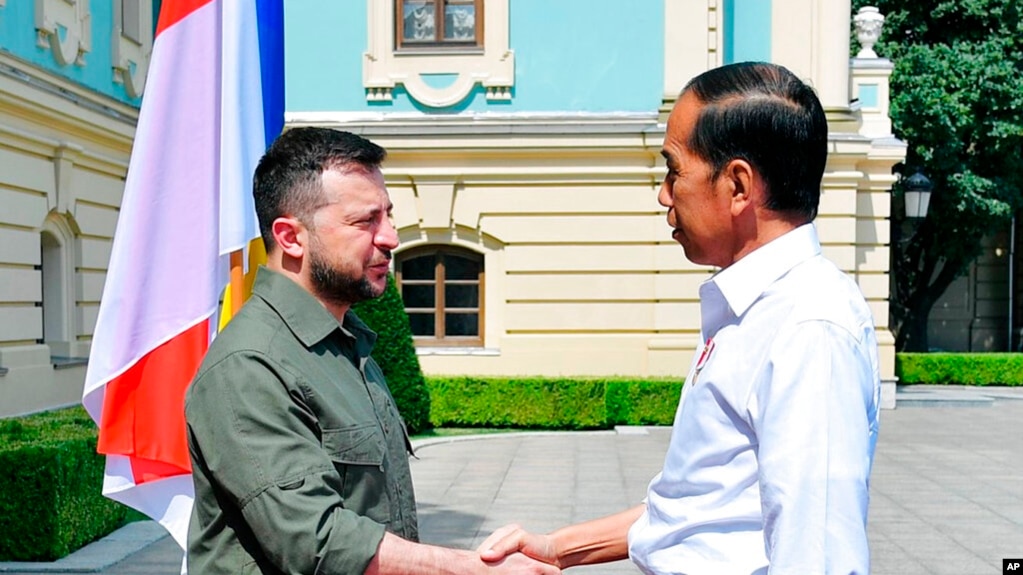 In this photo released by Indonesian Presidential Palace, Indonesian President Joko Widodo, right, shakes hands with his Ukrainian counterpart, Volodymyr Zelenskyy, during their meeting in Kyiv, Ukraine, June 29, 2022.