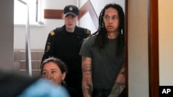 WNBA star and two-time Olympic gold medalist Brittney Griner is escorted to a courtroom for a hearing, in Khimki just outside Moscow, Russia, on June 27, 2022. More than four months after she was arrested at a Moscow airport for cannabis possession, Ameri