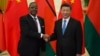 FILE - Malawi's then-President Arthur Peter Mutharika shakes hands with China's President Xi Jinping in Beijing, Sept. 1, 2018. China is working to protect its image in Africa after racist videos of African children made by a Chinese man living in Malawi surfaced this week.