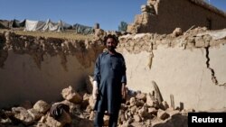 Shir Alam, 38, an Afghan man who says he lost his three sons in the recent earthquake, poses for a photograph in Wor Kali village in the Barmal district of Paktika province, Afghanistan, June 25, 2022.