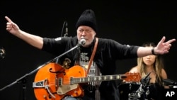 Canadian rock legend Randy Bachman sings as he plays with his reunited Gretsch guitar during the Lost and Found Guitar Exchange Ceremony Friday, July 1, 2022, at Canadian Embassy in Tokyo. 