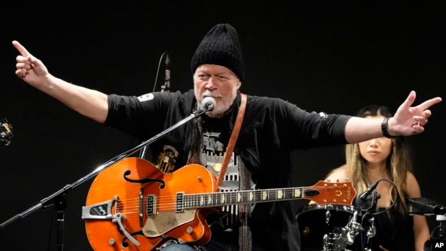 Canadian rock legend Randy Bachman sings as he plays with his reunited Gretsch guitar during the Lost and Found Guitar Exchange Ceremony Friday, July 1, 2022, at Canadian Embassy in Tokyo.