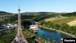  An aerial view shows an Eiffel Tower replica near Pristina, Kosovo June 19, 2022, as a form of consolation for the people who cannot go to Paris as they have been waiting for visa-free travel to the European Union. 