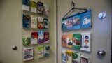 FILE - Information pamphlets hang on the back of a door in a procedure room at the Women's Health Clinic, which offers reproductive care, including abortions, in Winnipeg, Manitoba, June 28, 2022.