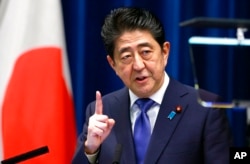 FILE - Shinzo Abe speaks during a press conference at the prime minister's official residence in Tokyo, on Sept. 25, 2017.