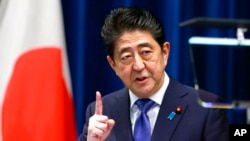 FILE - Japan's Prime Minister Shinzo Abe speaks during a press conference at the prime minister's official residence in Tokyo, on Sept. 25, 2017.