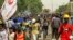 FILE: People march during a demonstration against military rule in the Bashdar area of el-Diam district of Sudan's capital Khartoum on June 16, 2022. - Sudanese security forces killed a protester that day in Omdurman during the latest rallies against last year's military coup.