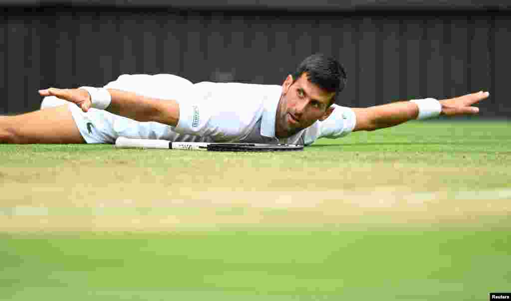 Serbia's Novak Djokovic reacts during his quarter final match against Italy's Jannik Sinner at Wimbledon, in London, Britain.