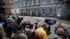 Members of the media wait outside 10 Downing Street, where British Prime Minister Boris Johnson is expected to make a statement, in London, July 7, 2022. 