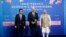 FILE -- From left, Japanese Prime Minister Fumio Kishida, U.S. President Joe Biden and Indian Prime Minister Narendra Modi pose for photos as they arrive at the Indo-Pacific Economic Framework for Prosperity launch event at the Izumi Garden Gallery in Tok