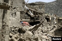 Rubble surrounds damaged houses after a recent earthquake in Gayan, Afghanistan, June 23, 2022.