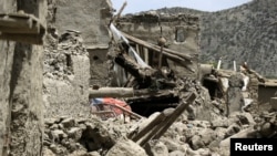 Rubble surrounds damaged houses after a recent earthquake in Gayan, Afghanistan, June 23, 2022. 