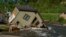 FILE - A house sits in Rock Creek after floodwaters washed away a road and a bridge in Red Lodge, Mont., on June 15, 2022. Climate experts and meteorologists say modeling programs used to predict storms aren't keeping up with increasingly extreme weather.