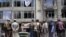 Taliban fighters gather at the site of an explosion in front of a Sikh temple in Kabul, Afghanistan (AP Photo/Ebrahim Noroozi)