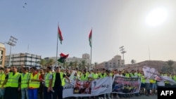 Libyans gather at the Martyrs' Square of Libya's capital Tripoli on July 1, 2022, to protest against the political situation and dire living conditions.