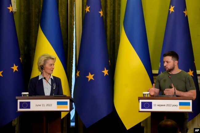 In this file photo, Ukrainian President Volodymyr Zelenskyy speaks during a joint press conference with European Commission President Ursula von der Leyen, left, in Kyiv, Ukraine, Saturday, June 11, 2022. (AP Photo/Natacha Pisarenko, Filw)