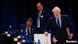 British Prime Minister Boris Johnson attends the round table of the first meeting of a NATO summit in Madrid, Spain June 29, 2022. 