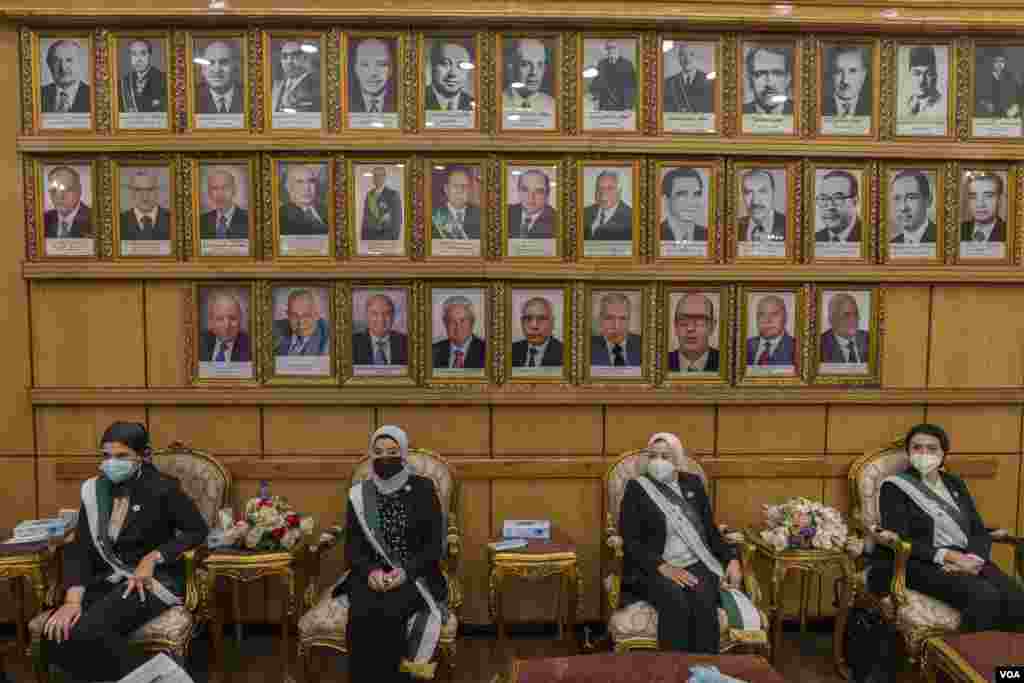 Newly appointed female judges join their all-male counterparts past and present on Egypt's State Council, one of the country's top courts, in Cairo, March 5, 2022. Meanwhile, the scales of equality and safety are still tipped against women nationwide. 