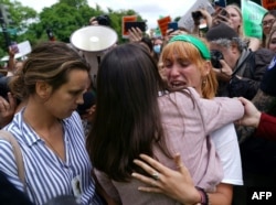 Abortion rights activists react outside the US Supreme Court in Washington, DC, on June 24, 2022. (Photo by Stefani Reynolds / AFP)