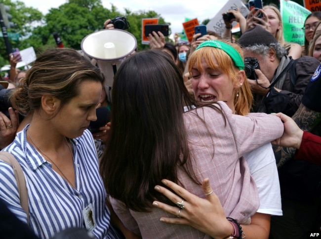 Abortion rights activists react outside the US Supreme Court in Washington, DC, on June 24, 2022. (Photo by Stefani Reynolds / AFP)