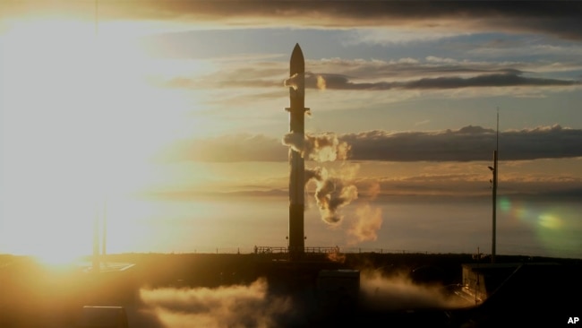 In this photo released by Rocket Lab, Rocket Lab's Electron rocket sits on the launch pad on the Mahia peninsula in New Zealand on May 17, 2022. (Rocket Lab via AP)