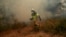 A firefighter works in the San Martin de Unx area in northern Spain, June 19, 2022. Firefighters in Spain are struggling to contain wildfires in several parts of the country which as been suffering an unusual heat wave for this time of the year.