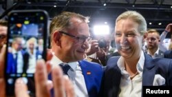 Tino Chrupalla and Alice Weidel react after being elected as co-leaders of the far-right Alternative for Germany (AfD) during a party congress in Riesa, Germany, June 18, 2022.