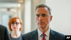 Pat Cipollone, White House counsel under then-President Donald Trump, walks to an interview room after a break in the Ford House Office Building to answer questions from investigators with the Jan. 6 Select Committee, in Washington, July 8, 2022. 