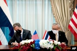 U.S. Secretary of State Antony Blinken, left, and Thailand's foreign minister, Don Pramudwinai, participate in a memorandum of understanding signing ceremony at the Thai Ministry of Foreign Affairs in Bangkok, July 10, 2022.