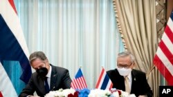 U.S. Secretary of State Antony Blinken, left, and Thailand's foreign minister, Don Pramudwinai, participate in a memorandum of understanding signing ceremony at the Thai Ministry of Foreign Affairs in Bangkok, July 10, 2022.