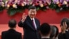 China's President Xi Jinping waves following his speech after a ceremony to inaugurate the city's new leader and government in Hong Kong on July 1, 2022, on the 25th anniversary of the city's handover from Britain to China.