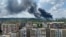 Smoke rises from the territory of an automotive center following recent shelling during Ukraine-Russia conflict in Donetsk, Ukraine, July 5, 2022. 