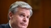 Direktur FBI Christopher Wray memberikan testimoni dalam sidang yang digelar oleh Senat AS mengenai penentuan budget untuk FBI pada tahun fiskal 2023. Sidang tersebut digelar di Washington, pada 25 Mei 2022. (Foto: Pool via AP/Bonnie Cash)