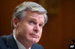 FILE - Director of the Federal Bureau of Investigation Christopher Wray testifies during a Senate Appropriations Subcommittee hearing in Washington, May 25, 2022. He and the leader of Britain's domestic intelligence agency raised alarms about the Chinese government on Wednesday.