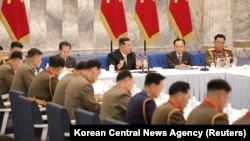 North Korean leader Kim Jong Un attends a convocation of the Expansion of the Central Military Commission of the Workers' Party of Korea in this photo released by the country's Korean Central News Agency, June 22, 2022.