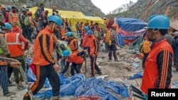 Rescuers search for survivors following a cloudburst near the holy Amarnath cave shrine in Kashmir, July 9, 2022.