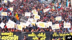 Students shout anti-government slogans during a protest march in Colombo, Sri Lanka, July 8, 2022.