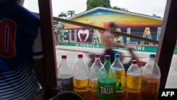 Gasoline bottles are sold in the streets of Atalaia no Norte, Amazonas state, Brazil, on June 22, 2022, because the city doesn't have a gas station.