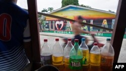 Gasoline bottles are sold in the streets of Atalaia no Norte, Amazonas state, Brazil, on June 22, 2022, because the city doesn't have a gas station.