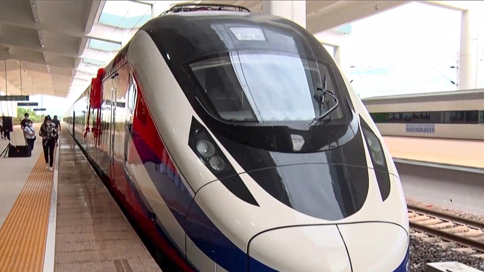 This frame grab from Lao National TV video footage taken on Oct.16, 2021 via AFPTV shows the Lane Xang bullet train at the Vientiane Railway Station in Vientiane, Laos. A new $6 billion Chinese-built railway line opened in Laos on Dec. 3, 2021.