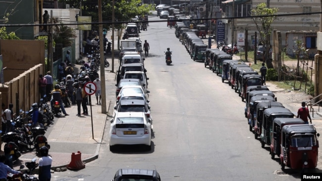 Motorbikes, cars and three-wheelers wait in a queue to buy petrol due to fuel shortage, during the country's economic crisis, in Colombo, Sri Lanka, June 29, 2022.