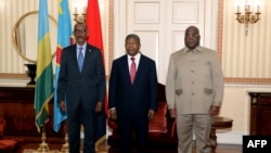 FILE — Rwanda's President Paul Kagame meets with his Congolese counterpart Felix Tshisekedi and Angola's President Joao Lourenco, at the Great Lakes International Conference, in Luanda, Angola, on July 6, 2022. 