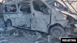 A view shows a damaged vehicle, as Russia's invasion of Ukraine continues, in Bakhmut, Donetsk Oblast, Ukraine in this still image obtained from a social media video released on July 2, 2022. National Police of Ukraine/Handout via REUTERS