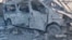 A view shows a damaged vehicle, as Russia's invasion of Ukraine continues, in Bakhmut, Donetsk Oblast, Ukraine in this still image obtained from a social media video released on July 2, 2022. National Police of Ukraine/Handout via REUTERS