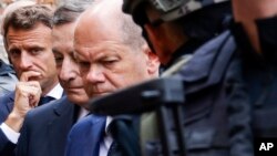 French President Emmanuel Macron, left, Italian Prime Minister Mario Draghi, center, and German Chancellor Olaf Scholz visit Irpin, outside Kyiv, Ukraine, in a show of collective European support for the Ukrainian people as they resist Russia&#39;s invasion.