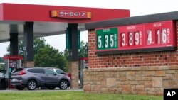 Gas prices are displayed at a station, July 7, 2022, in Sandston, Virginia. Gas prices in much of the United States passed $5 a gallon last month before a slight drop.