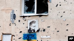 A Ukrainian national flag is painted on a building in Irpin, outside Kyiv, June 16, 2022.