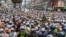 Police (foreground) stop activists and supporters as they try to march towards the Indian embassy in Dhaka on June 16, 2022, to protest against the remarks on the Prophet Mohammed by an India's ruling party official. 